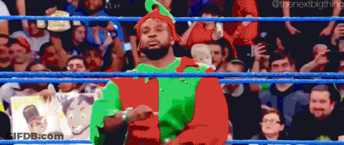 Pixel Art Wrestler In Red And Green Elf Outfit GIF
