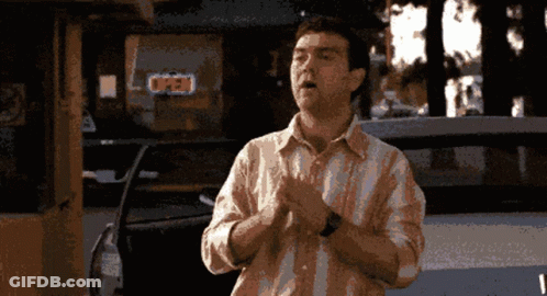 Pixelated Man In Front Of Open Store GIF