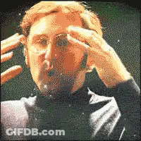 Pixelated Man In Glasses And Suit GIF