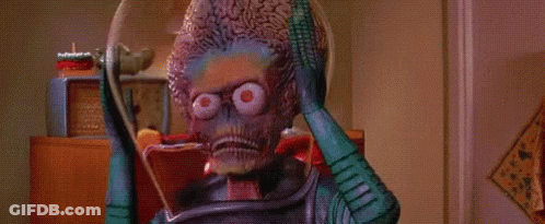 Pixelated Man In Green Suit With Green Head GIF