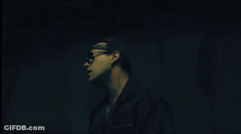 Pixelated Man Playing DJ Set With Crown On Face GIF