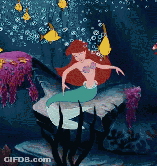 Pixelated Mermaid Holding Baby GIF
