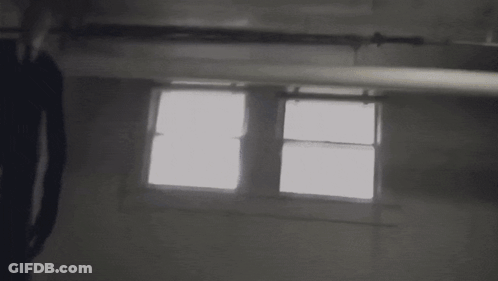 Pixelated Person Standing In Dark Room GIF