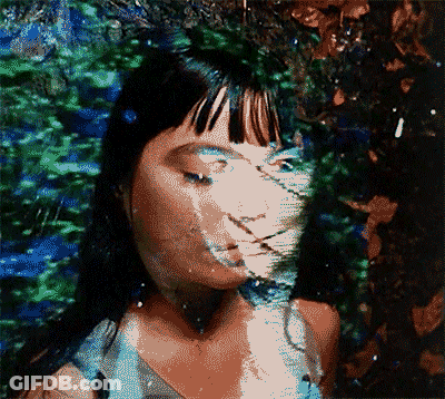 Pixelated Woman Face Surrounded By Trees GIF