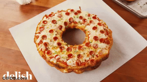 Pizza Donut With Pepperoni And Cheese Saying Delish GIF