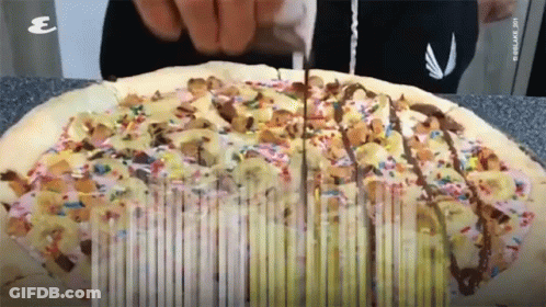Pizza With Sprinkles Being Sliced GIF