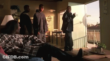 Plaid Shirt Man Laying On Couch Men Standing GIF