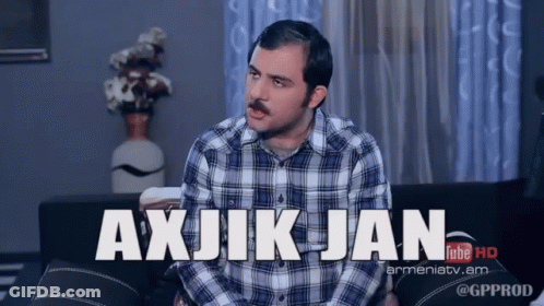 Plaid Shirt Man Sitting On Couch Saying Axjikjan GIF