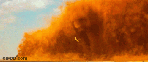 Plane Flying Through Orange Smoke GIF