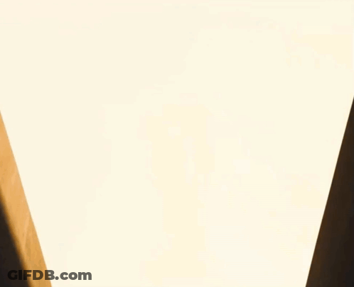 Planes Flying Over Building With White Sky GIF