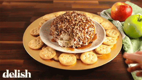 Plate Of Crackers And Apples Saying Delish GIF
