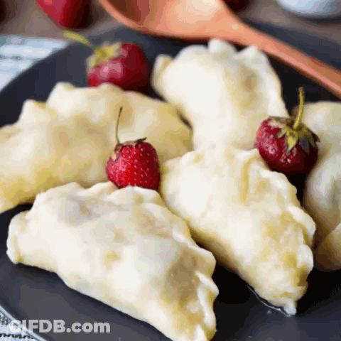 Plate Of Dumplings With Strawberries GIF