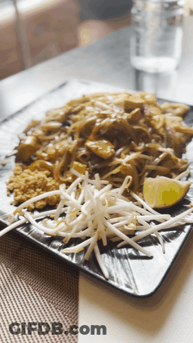 Plate Of Food With Bean Sprouts And Lime Slice GIF