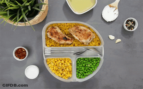 Plate Of Food With Corn Peas And Chicken GIF