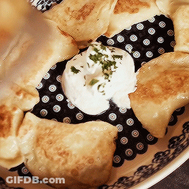 Plate Of Food With Sour Cream And Parsley GIF