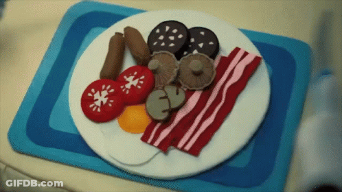 Plate Of Food With Tomatoes Bacon And Mushrooms GIF