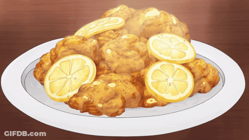 Plate Of Fried Food With Lemon Slices GIF