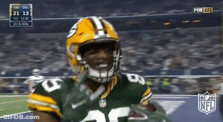 Player Giving Ball To Referee While Doing Hook Em Sign GIF