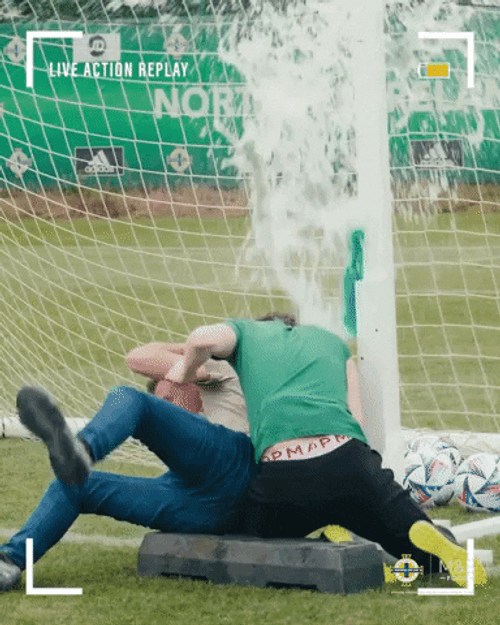 Playful Athletes Drenched With Water GIF