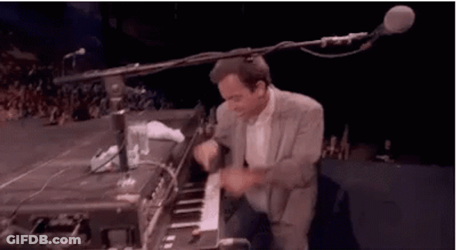 Playful Billy Joel Playing Piano GIF