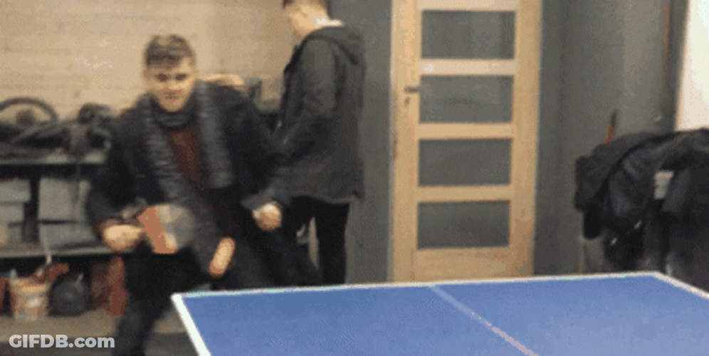 Playing Ping Pong Wearing Winter Outfit GIF