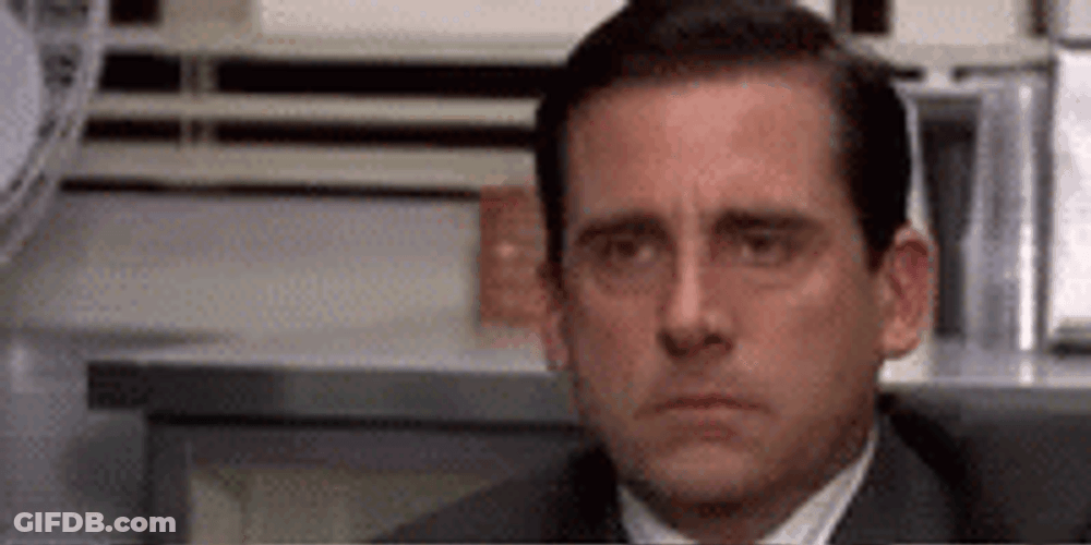 Poker Face Michael Scott The Office GIF