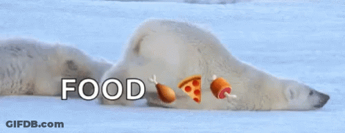 Polar Bear Laying In Snow With Food Emojis On Face GIF