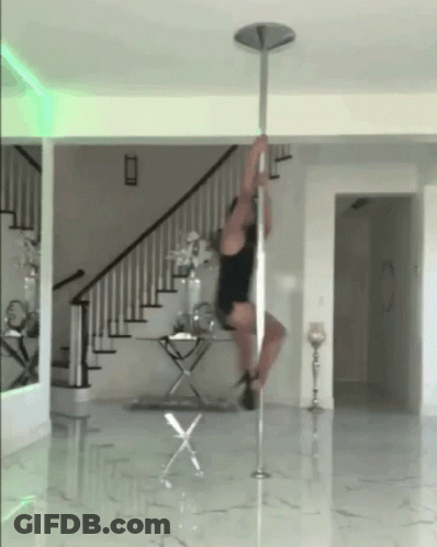 Pole Dancer Doing Trick In Living Room GIF