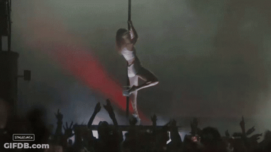 Pole Dancing In Stage In Crowded Event GIF
