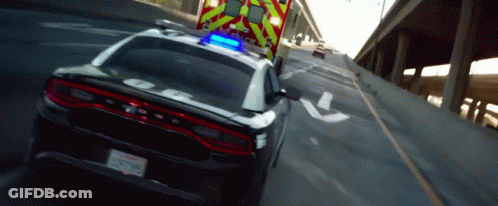 Police Car Driving Next To Ambulance GIF