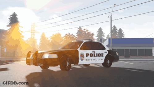 Police Car From Crystal Lake Driving Down Street GIF