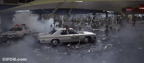 Police Car Number 10 Surrounded By Zombies GIF