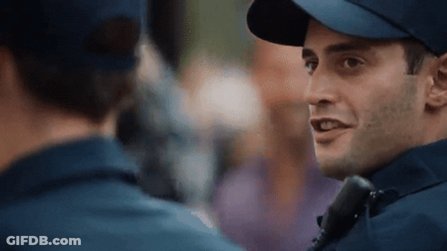 Police Cop Smiling Head Shake GIF