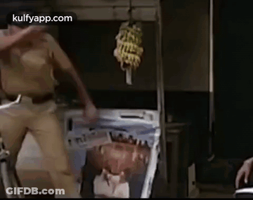 Police Man Dancing In Front Of Painting GIF