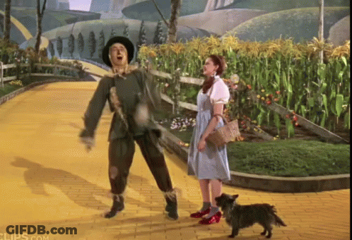 Police Man Talking To Puppet On Red Couch GIF
