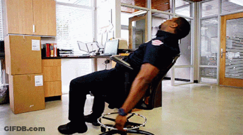 Police Officer Head Down In Office Chair GIF