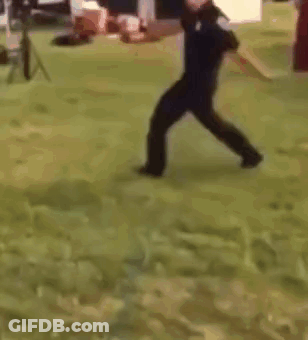 Police Officer Holding Fire Extinguisher GIF