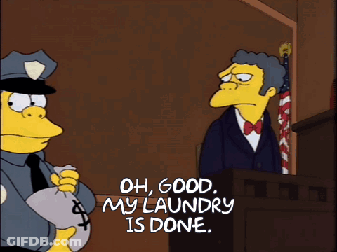Police Officer Holding Money Bag Saying Oh Good My Laundry Is Done GIF