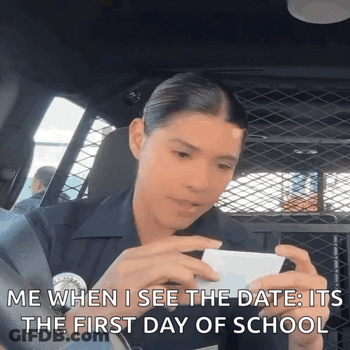 Police Officer In Back Of Car On Phone GIF
