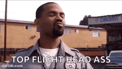 Police Officer In Front Of Building Eyes Closed GIF