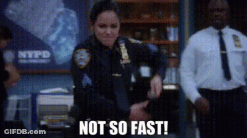 Police Officer In Front Of NYPD Sign GIF