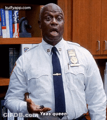 Police Officer In White Shirt With Key Saying Yaas Queen GIF