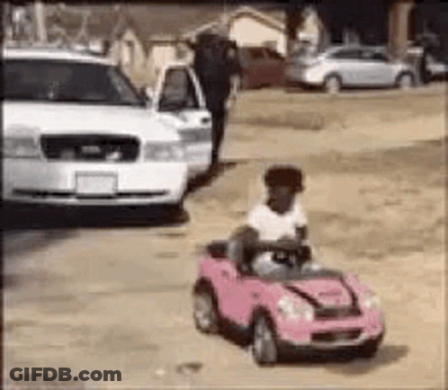 Police Officer Riding Tricycle Pressing Play GIF