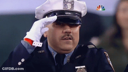 Police Officer Saluting With NBC Logo GIF
