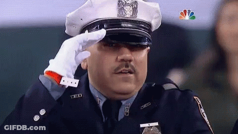 Police Officer Saluting With NBC Logo GIF