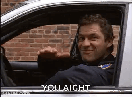 Police Officer Smiling In Car GIF
