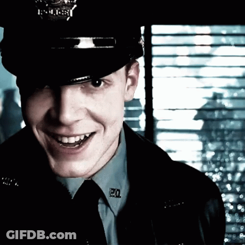 Police Officer Smiling With PD Badge GIF