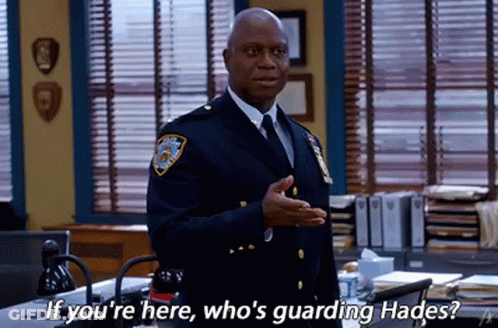 Police Officer Standing At Desk Talking GIF