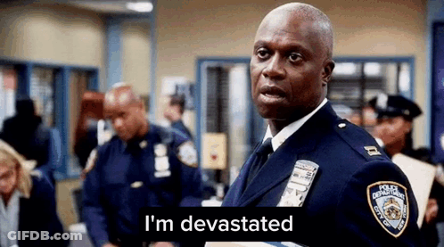 Police Officer Standing In Front Of Group GIF
