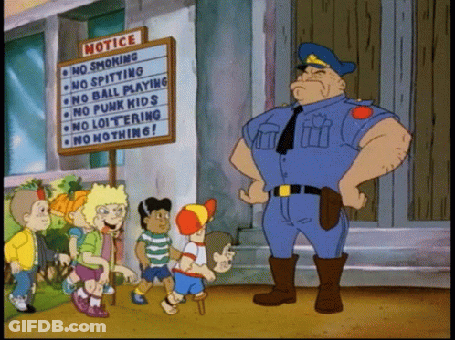 Police Officer Standing In Front Of Notice Board GIF